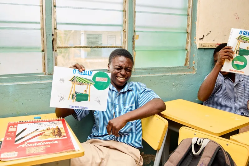 A student presenting a completed design at a WDA school workshop