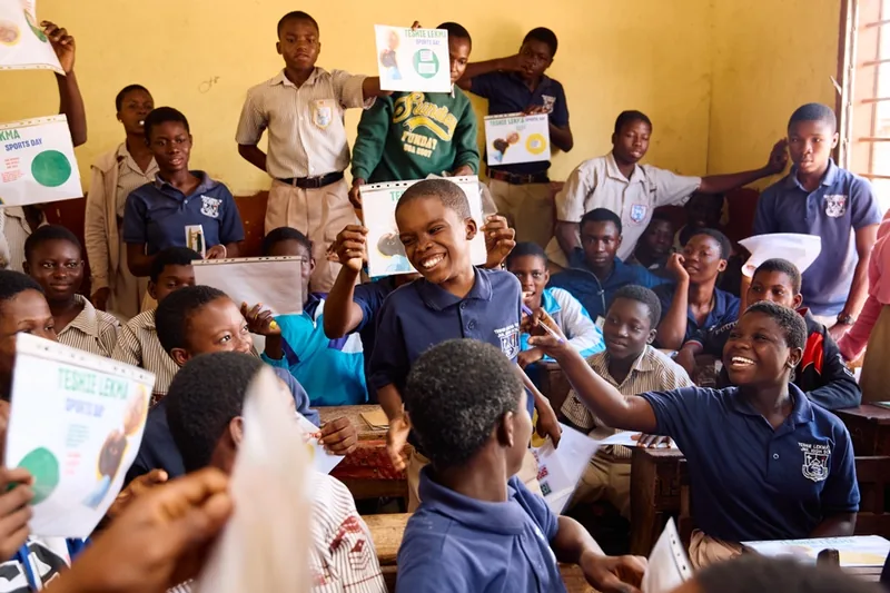 Students celebrating their work during a WDA school workshop